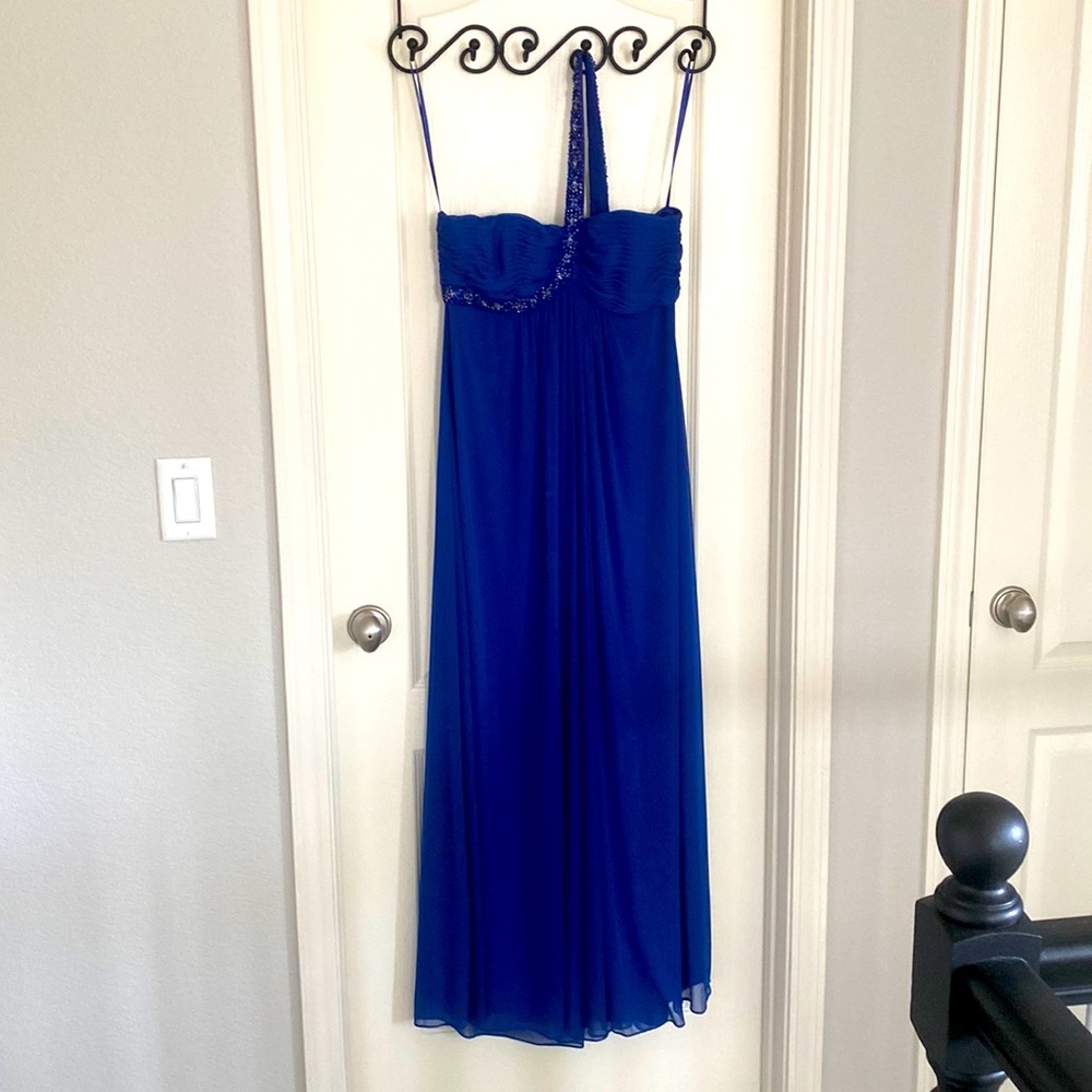 Size 12 royal blue asymmetrical full length gown with detail beading on strap